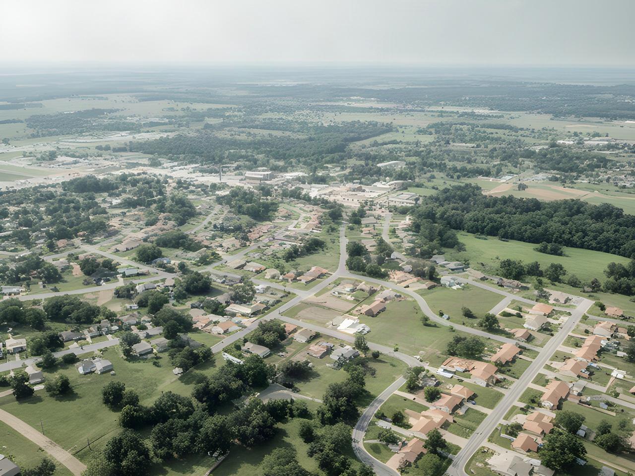 Aerial view of Clarksville, Arkansas streets and green spaces representing the local cleaning service area